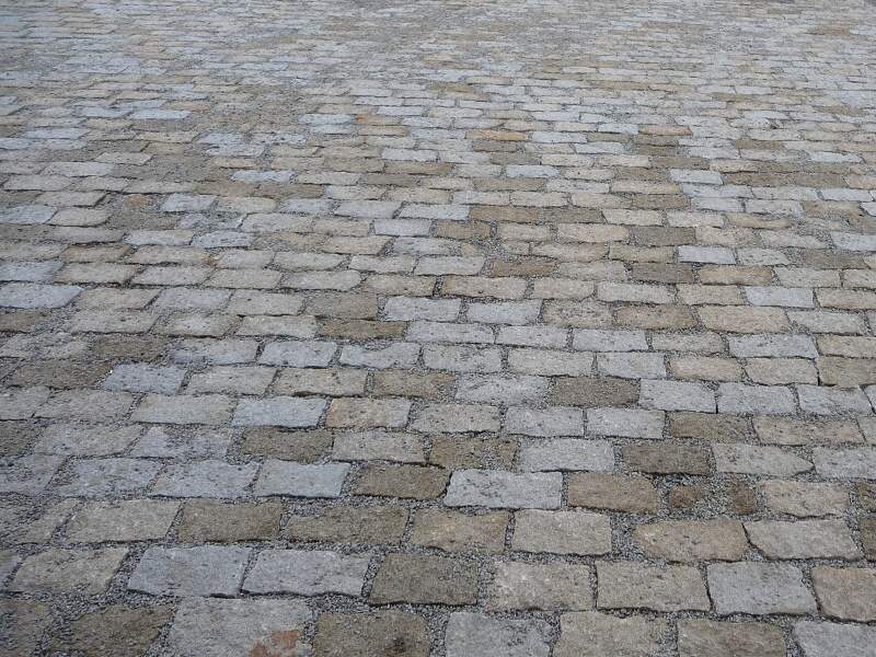 Žulové kostky — detail kamenné dlažby